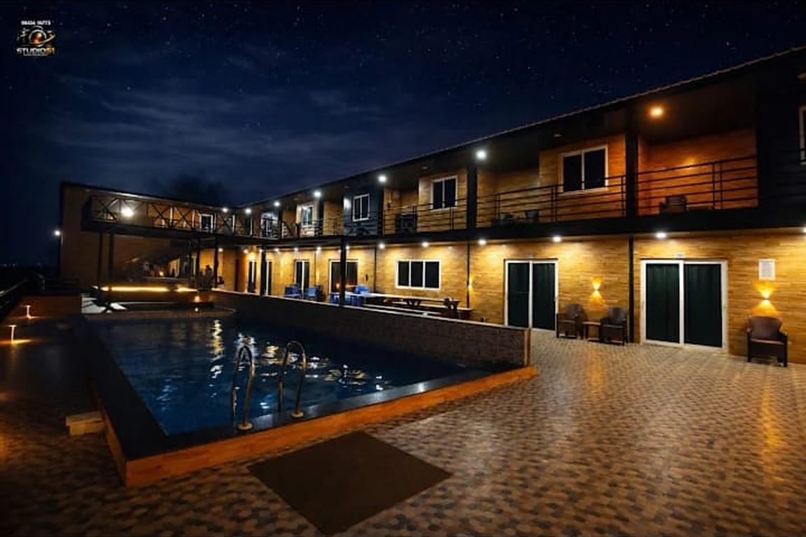Hashtag Hive pool and rooms at night